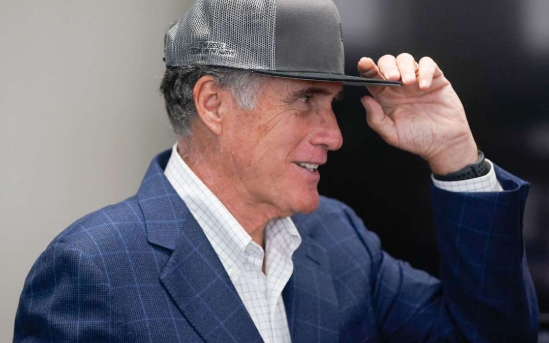 Utah Sen. Mitt Romney wears a hat to avoid harassment from Trump supporters in Palm Beach