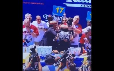 Joey Chestnut rips head off protester during Nathan’s Hot Dog Championship…