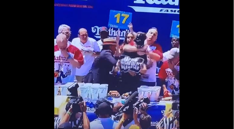 Joey Chestnut rips head off protester during Nathan’s Hot Dog Championship…